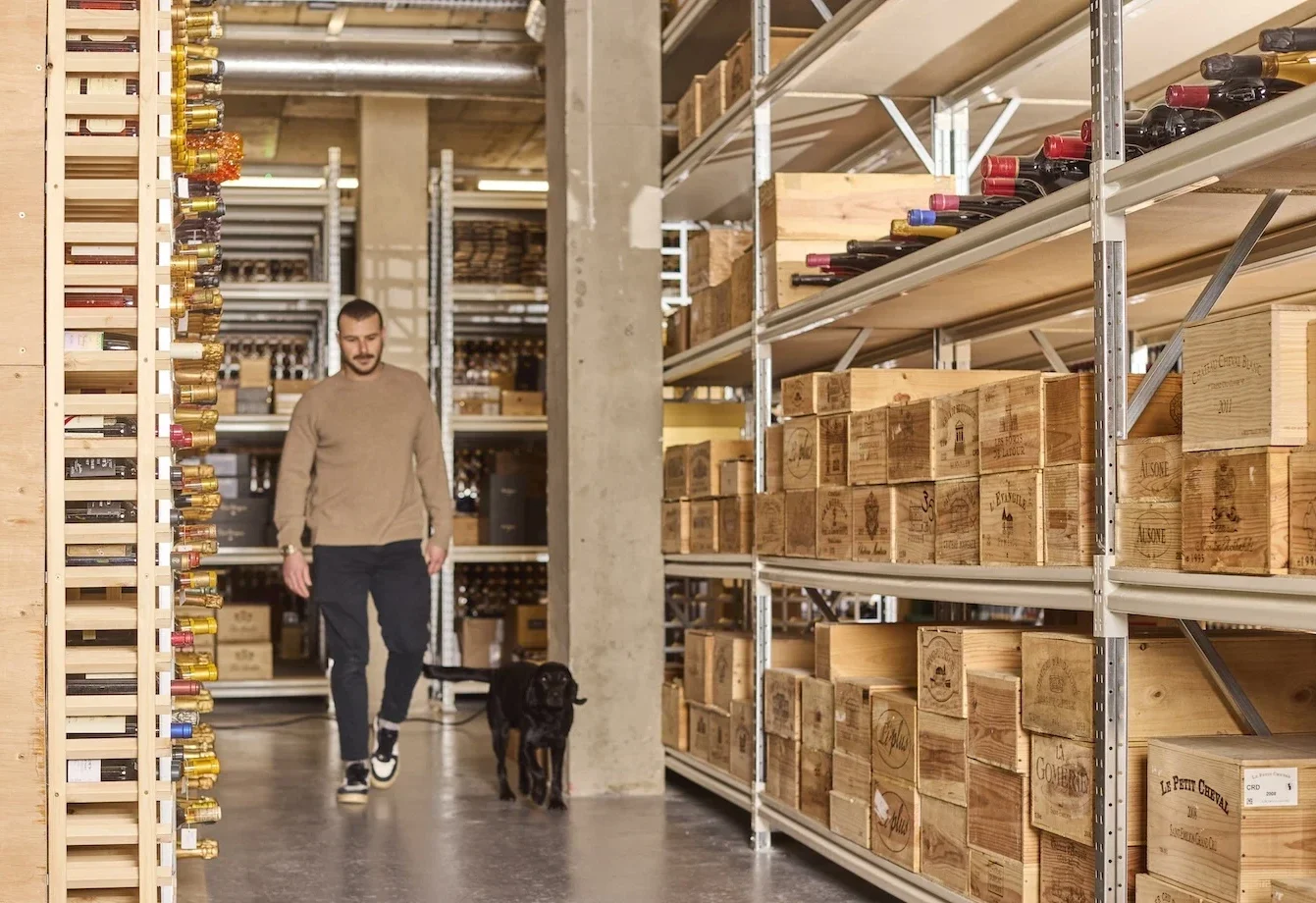 Man walking through cellar with a dog